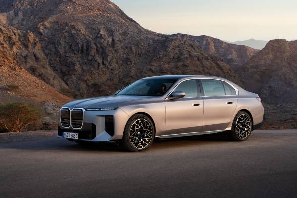 Luxury electric sedan parked on a scenic mountain road, showcasing premium automotive design, featured in a web design case study designed by Cheap Website Designer.