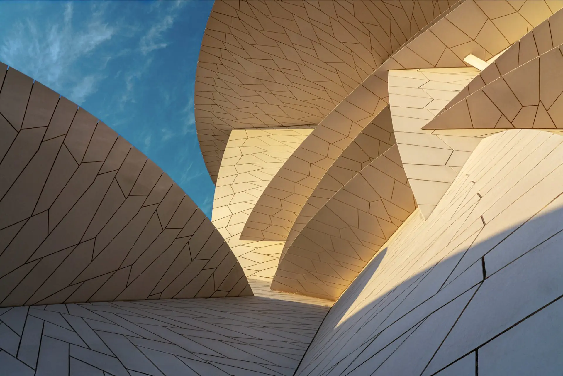 Modern architectural building with futuristic geometric design and curved exterior walls, featured in a web design case study designed by Cheap Website Designer.
